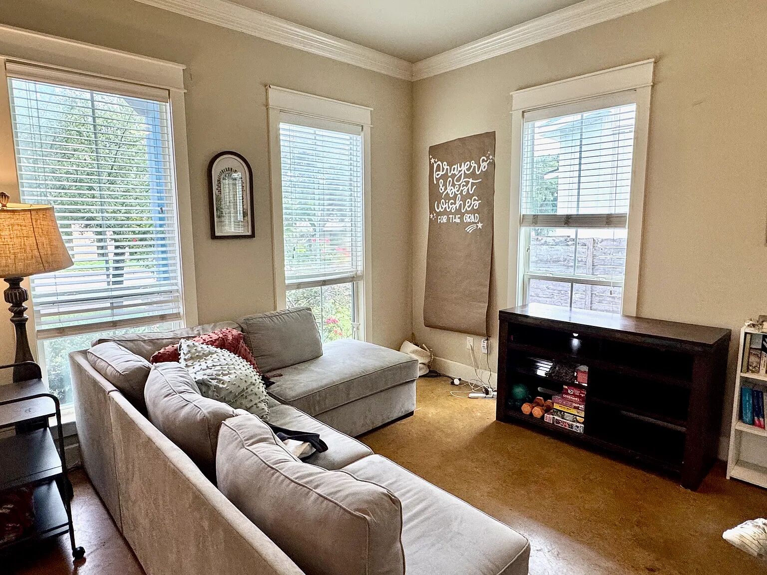 4420 Red River Street, Unit B Austin, TX 78751 - Photo 2 of 11 Well-lit living area with crown molding and warm flooring for comfortable gatherings.