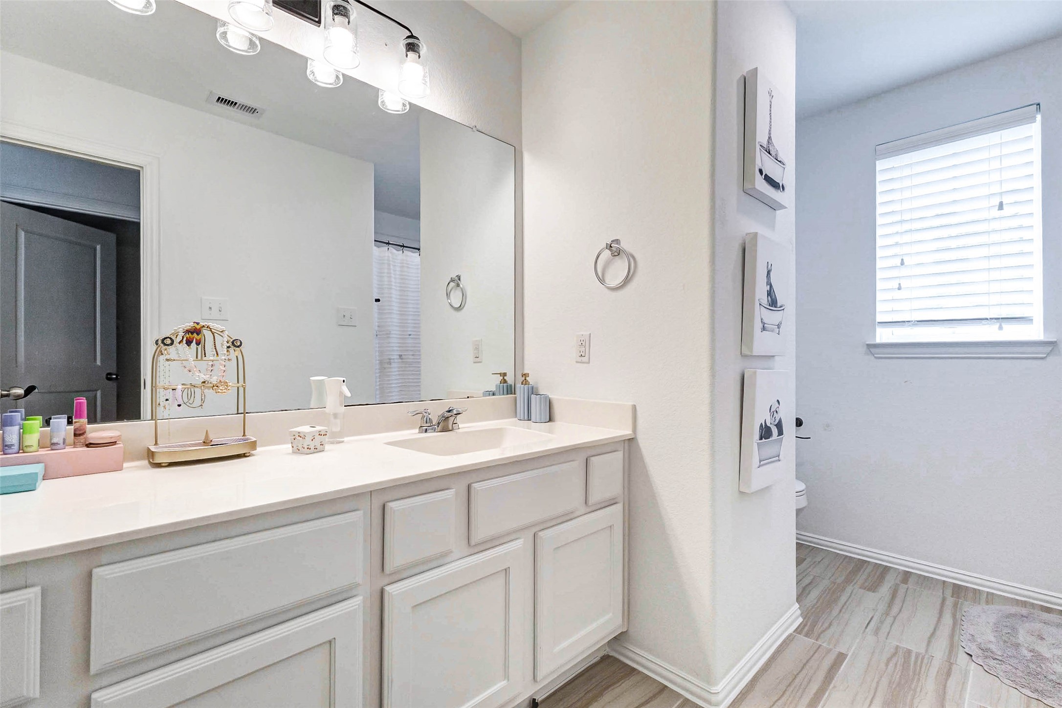3210 Montclair Orchard Trace Spring, TX 77386 - Photo 23 of 38 a bathroom with a sink and a mirror