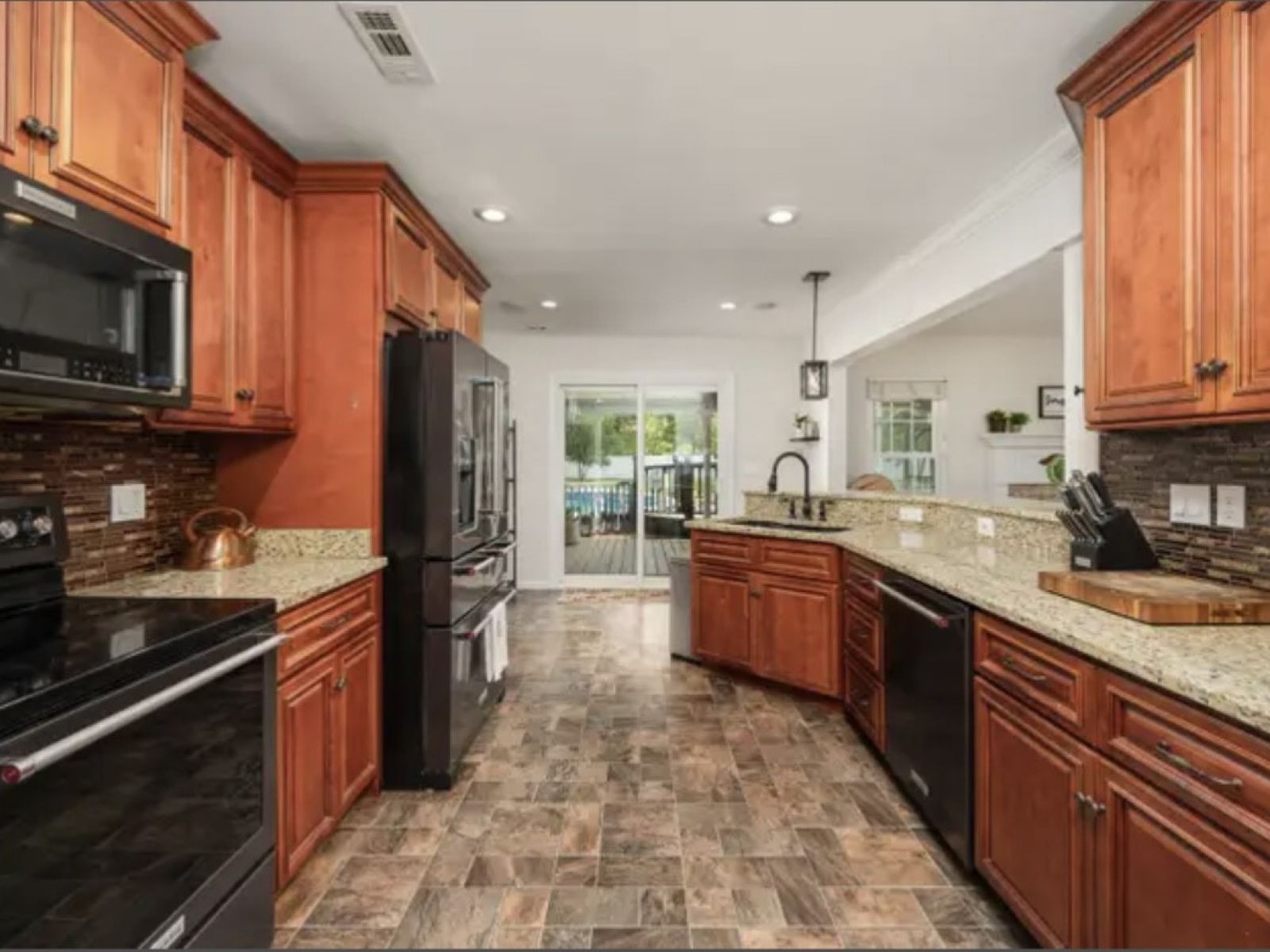 1123 Bramble Trail Murfreesboro, TN 37129 - Photo 4 of 10 a large kitchen with stainless steel appliances granite countertop a stove sink and cabinets