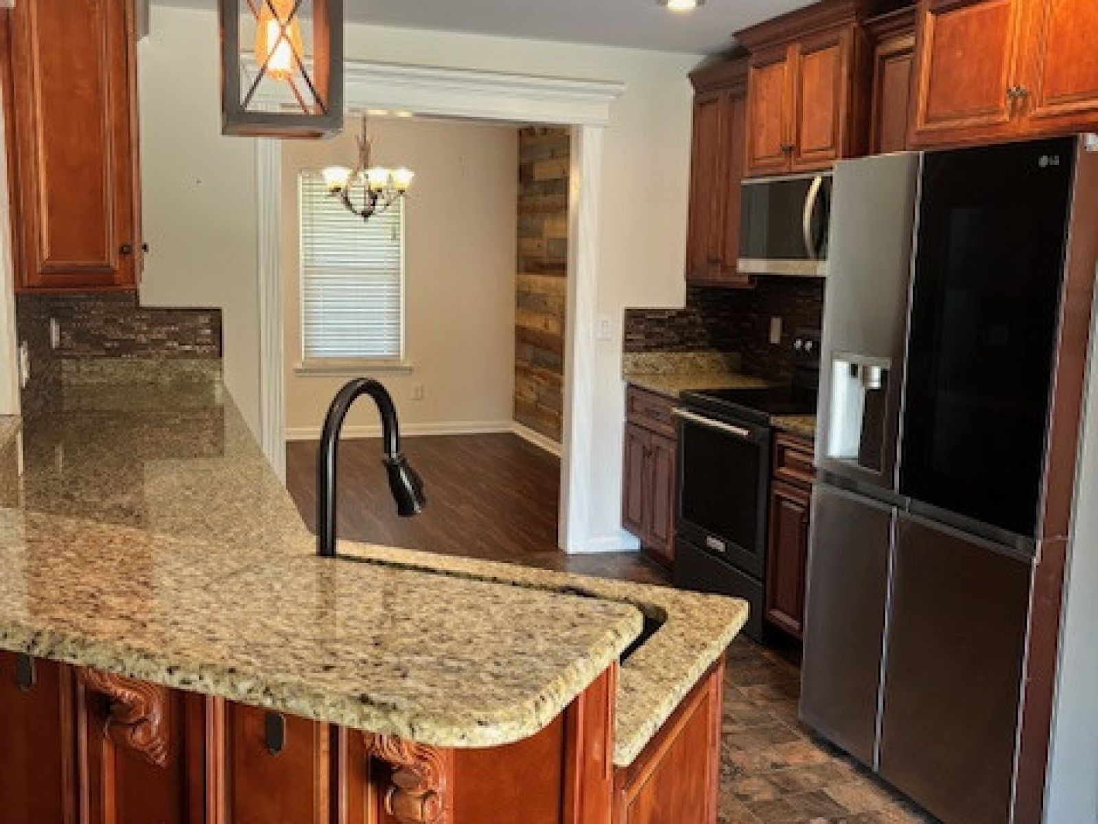 1123 Bramble Trail Murfreesboro, TN 37129 - Photo 6 of 10 a kitchen with stainless steel appliances granite countertop a refrigerator stove and cabinets