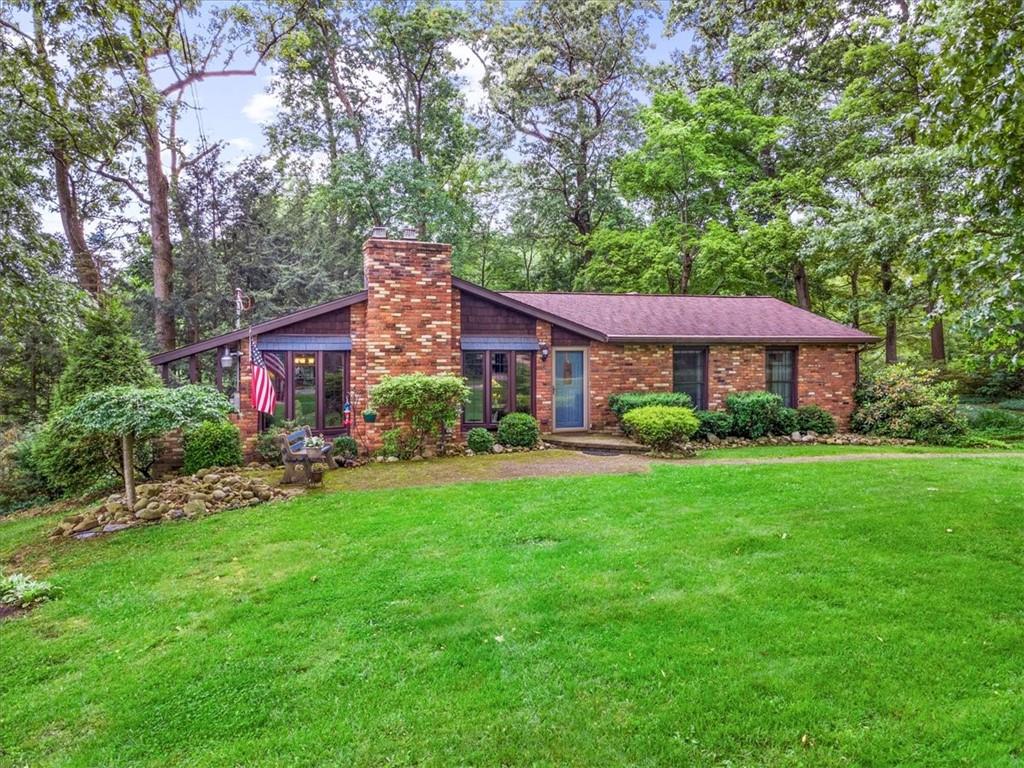 206 Ridgeway Drive Baden, PA 15005 - Photo 1 of 25 a front view of a house with garden