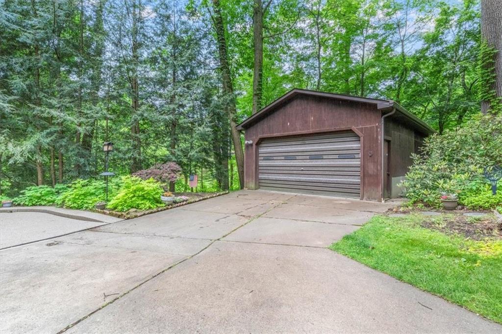 206 Ridgeway Drive Baden, PA 15005 - Photo 23 of 25 a pathway of a house with potted plants