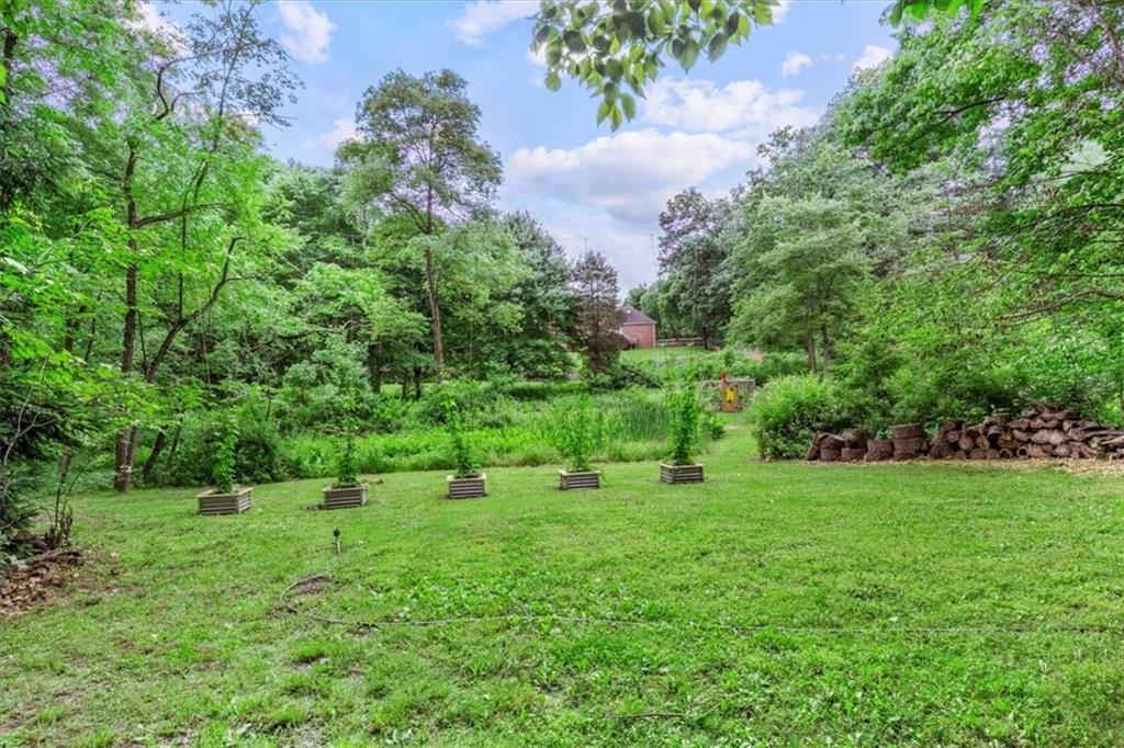 206 Ridgeway Drive Baden, PA 15005 - Photo 24 of 25 a view of a grassy field with trees