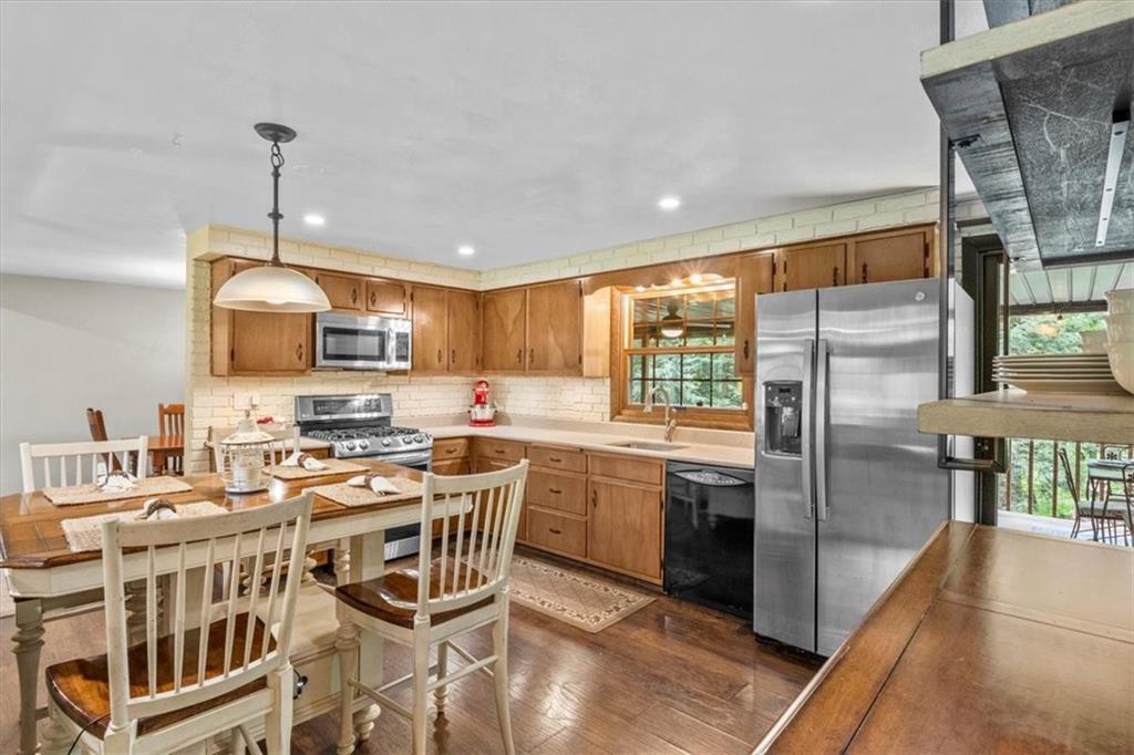 206 Ridgeway Drive Baden, PA 15005 - Photo 7 of 25 a kitchen with stainless steel appliances a stove a sink refrigerator and microwave