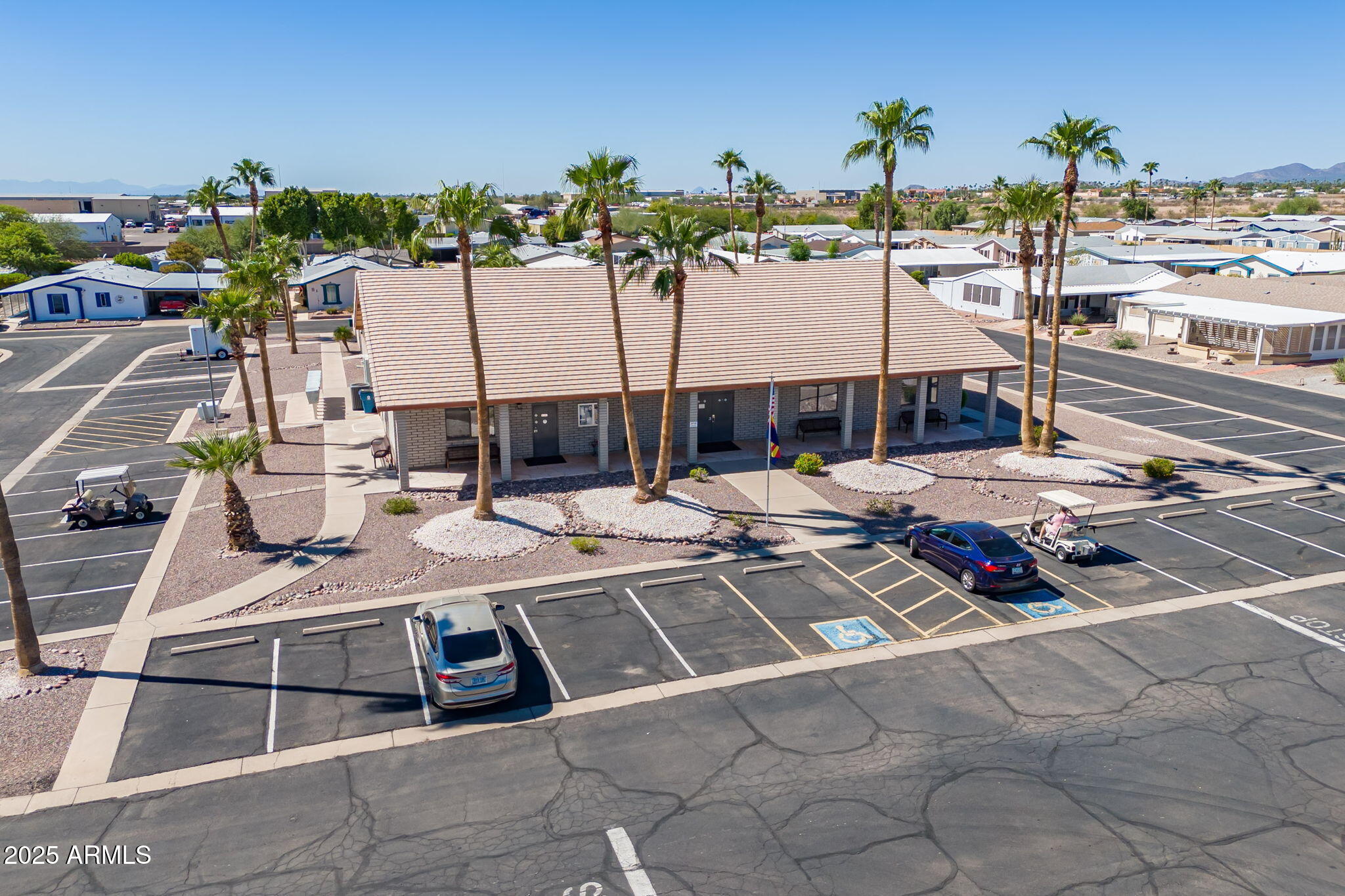 3700 South Tomahawk Road, Unit 39 Apache Junction, AZ 85119 - Photo 50 of 53 a view of a patio with swimming pool table and chairs