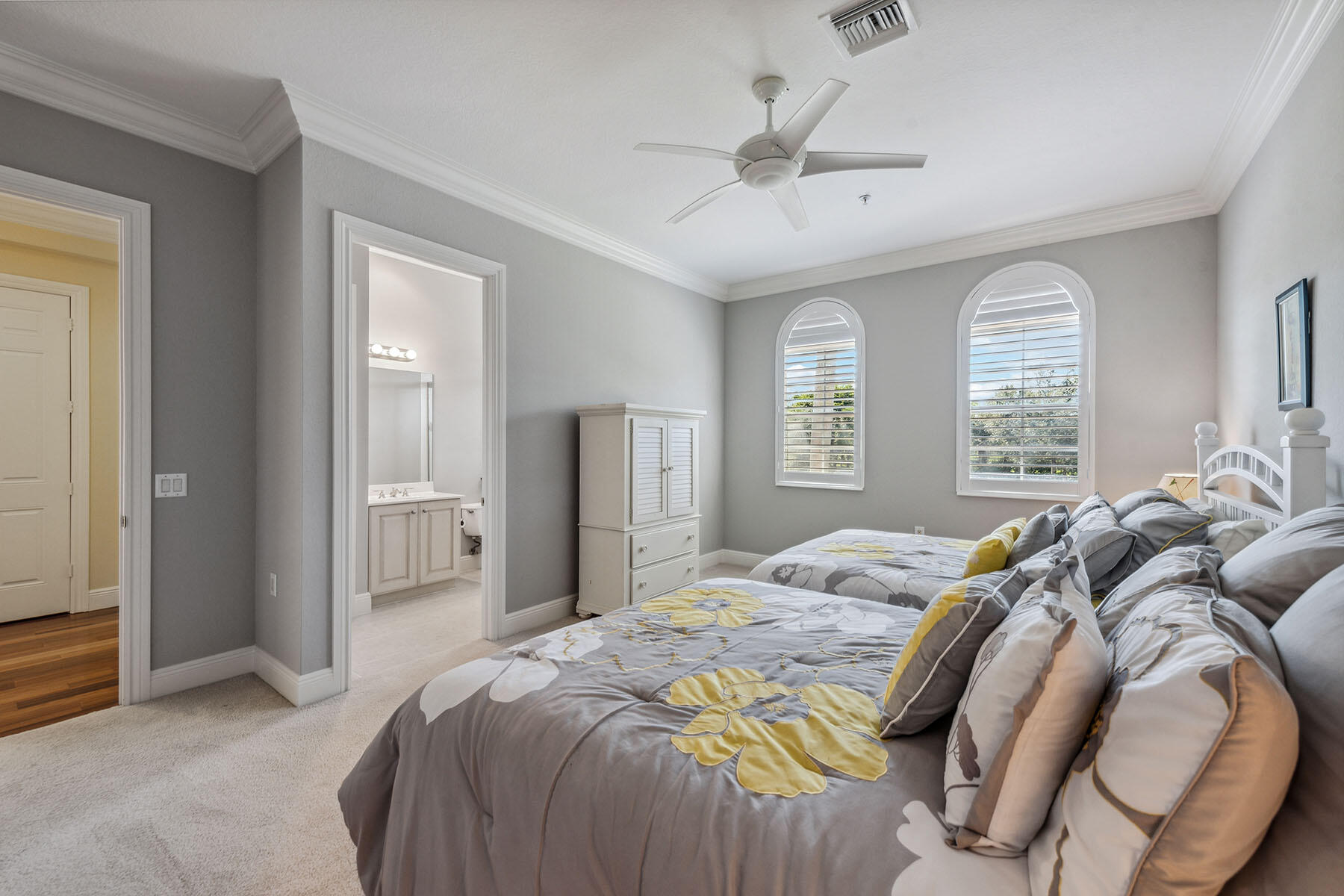 3189 Aviamar Circle, Unit 202 Naples, FL 34114 - Photo 16 of 50 a bed room with a bed and a television