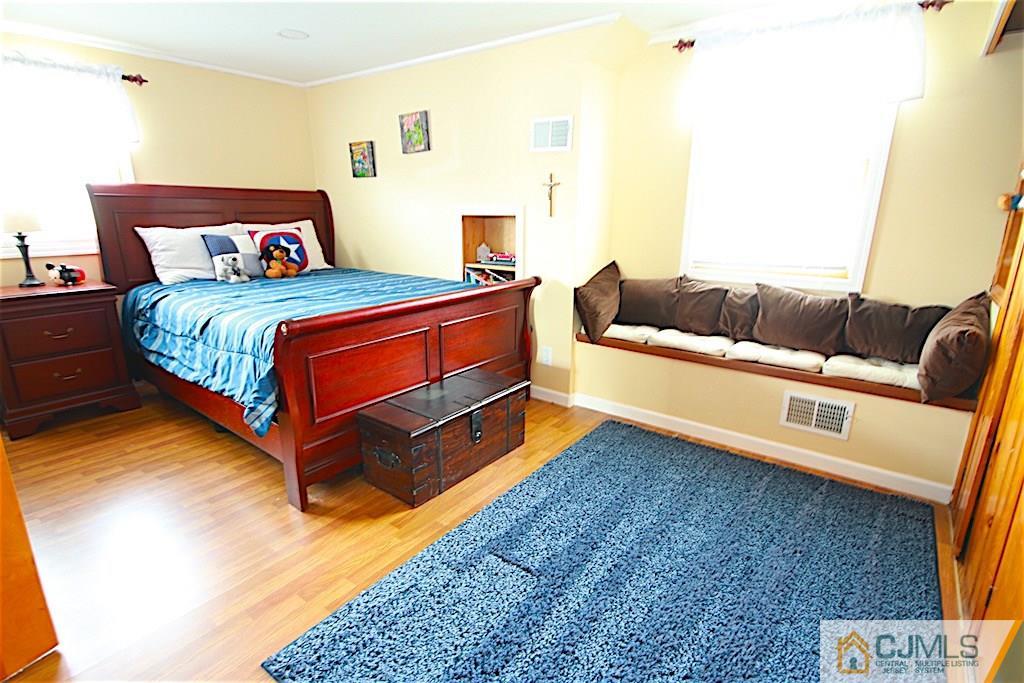 179 Midfield Road Colonia, NJ 07067 - Photo 13 of 18 a bedroom with a bed and a couch