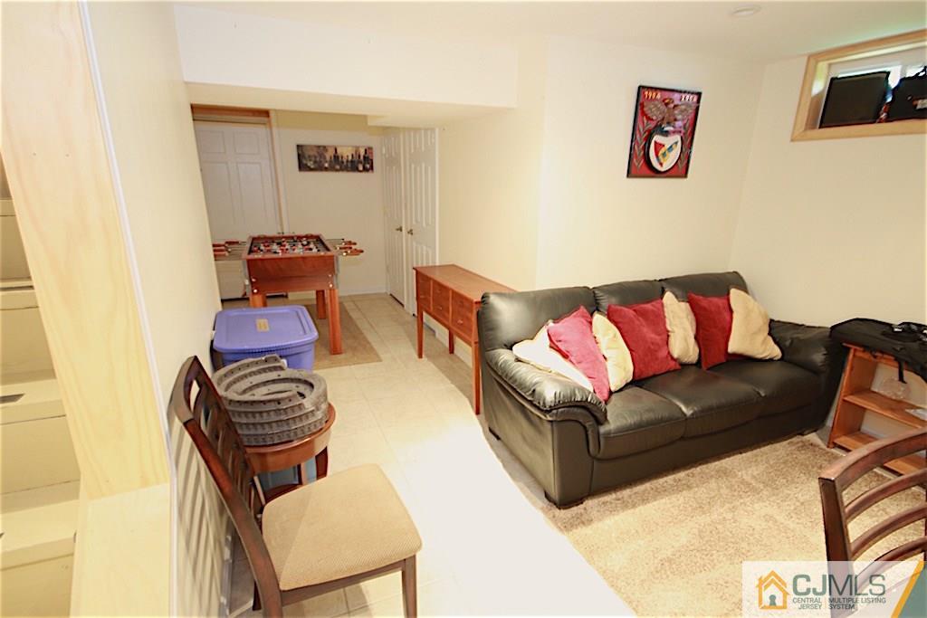 179 Midfield Road Colonia, NJ 07067 - Photo 16 of 18 a living room with furniture and a couch