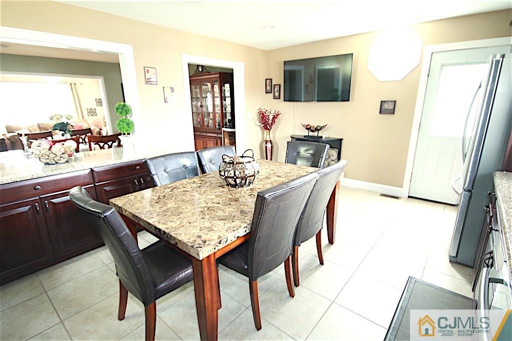 179 Midfield Road Colonia, NJ 07067 - Photo 4 of 18 a dining room with furniture and window