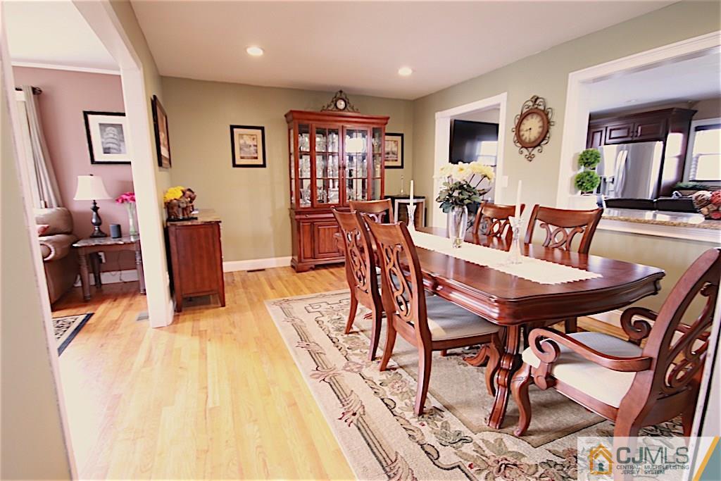 179 Midfield Road Colonia, NJ 07067 - Photo 7 of 18 a view of a dining room with furniture