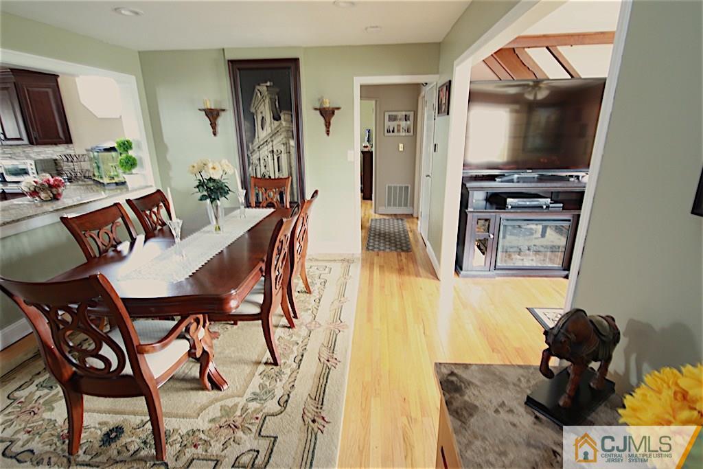 179 Midfield Road Colonia, NJ 07067 - Photo 8 of 18 a living room with furniture and a flat screen tv