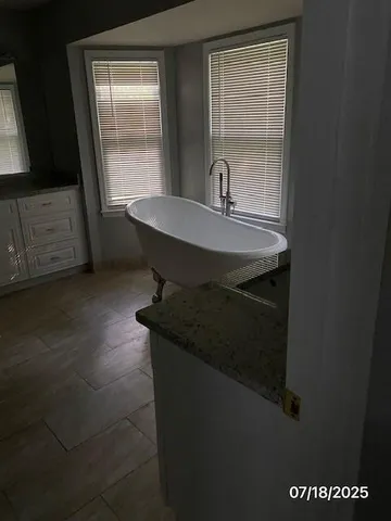 a room with a table chairs and a wooden floor