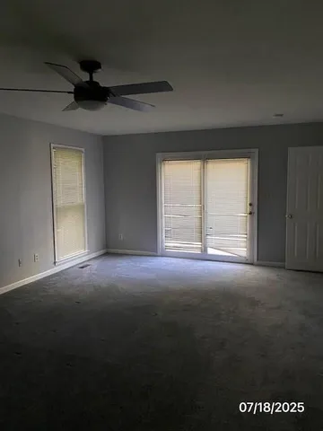 a view of empty room with windows