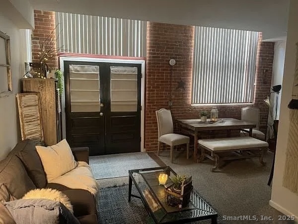 839 Main Street, Unit 22 Torrington, CT 06790 - Photo 2 of 17 a living room with furniture