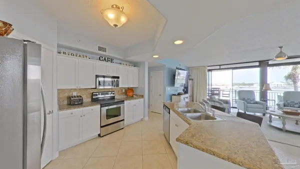 a bathroom with a sink a large mirror and shower