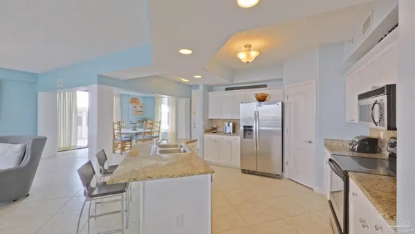a spacious bathroom with a double vanity sink and a mirror