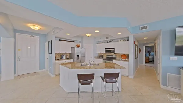 a bathroom with a toilet and a shower curtain