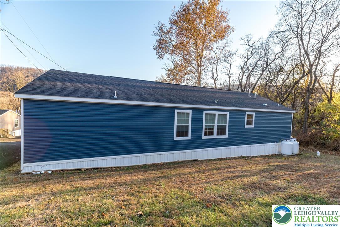 465 Royal Manor Road, Unit LOT 6 Easton, PA 18042 - Photo 23 of 25 a house that has a tree in front of it