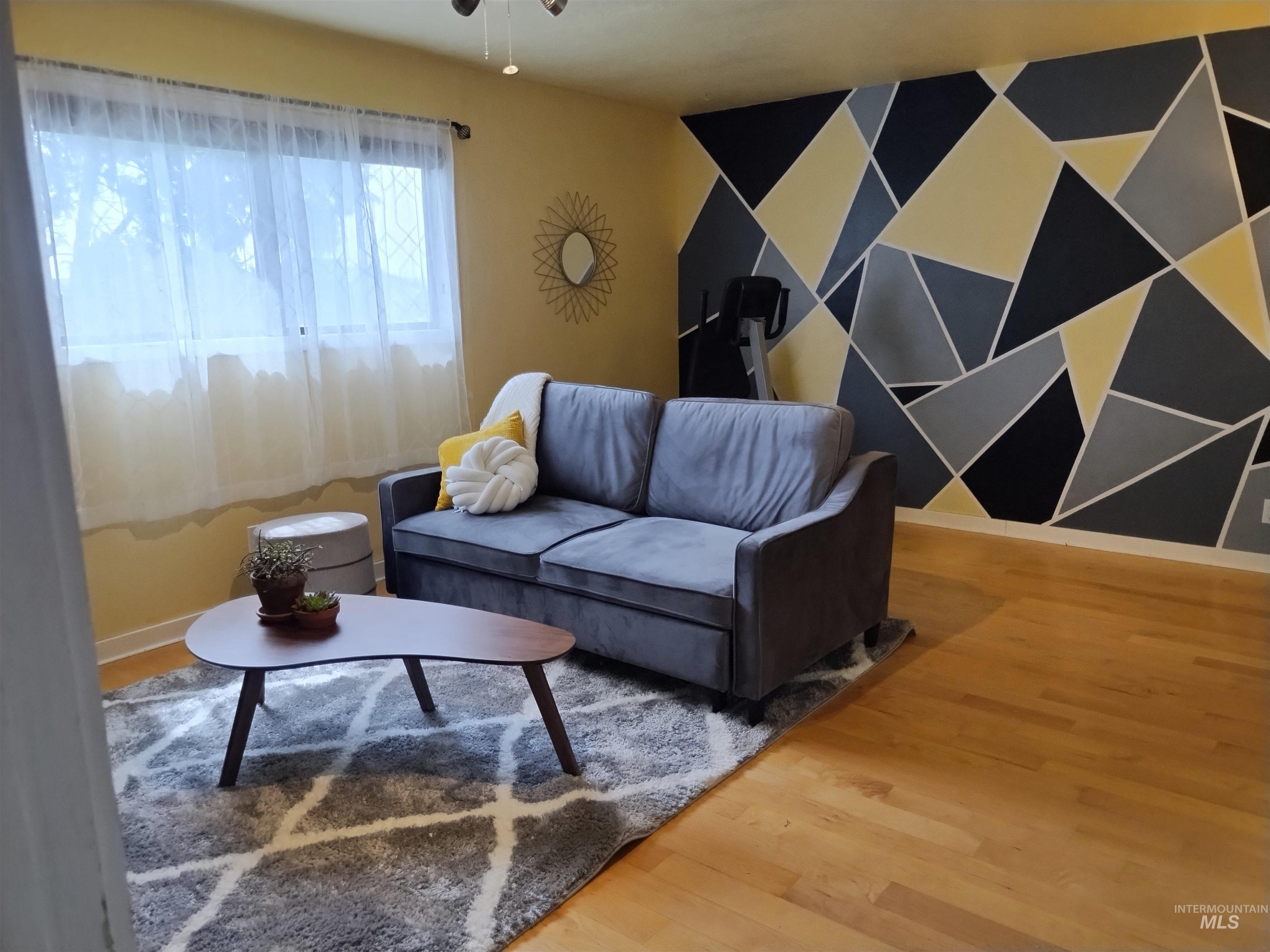 14526 Perfection Lane Caldwell, ID 83607 - Photo 27 of 47 Open concept living area featuring wood-finish flooring
