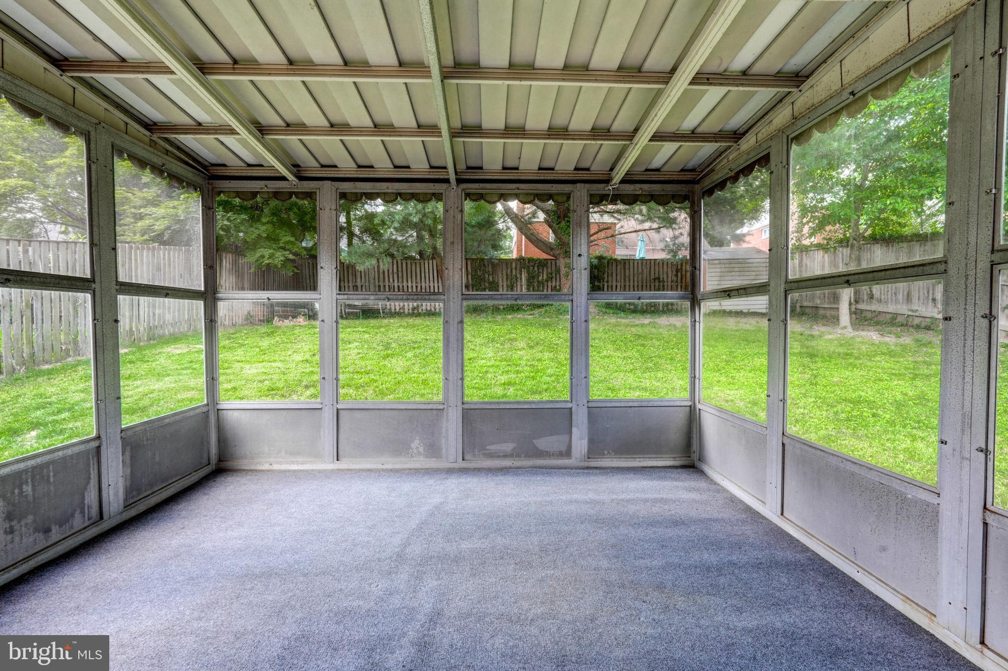 9912 Markham Street Silver Spring, MD 20901 - Photo 28 of 28 a view of empty room with sliding window