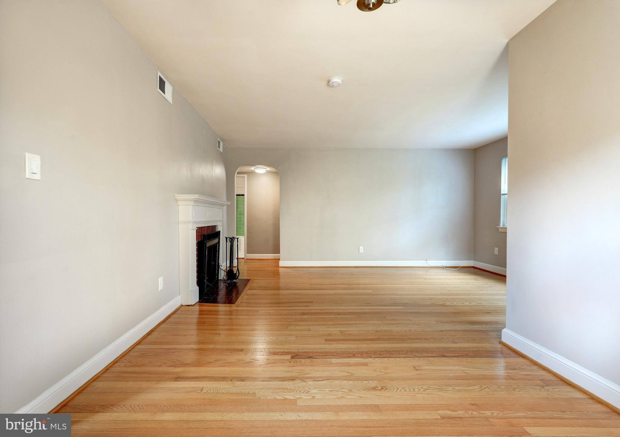 9912 Markham Street Silver Spring, MD 20901 - Photo 10 of 28 a view of empty room with wooden floor