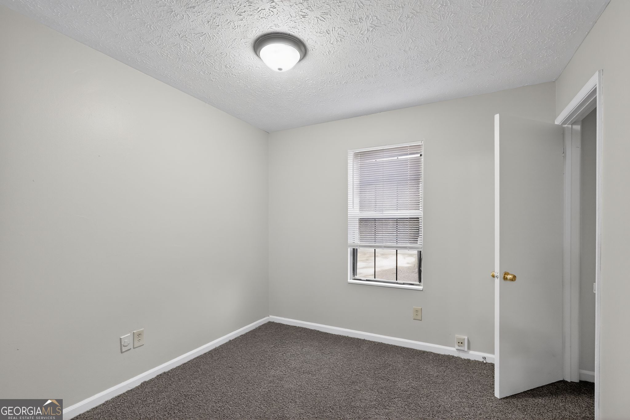 5515 Rock Springs Road Lithonia, GA 30038 - Photo 15 of 34 an empty room with windows