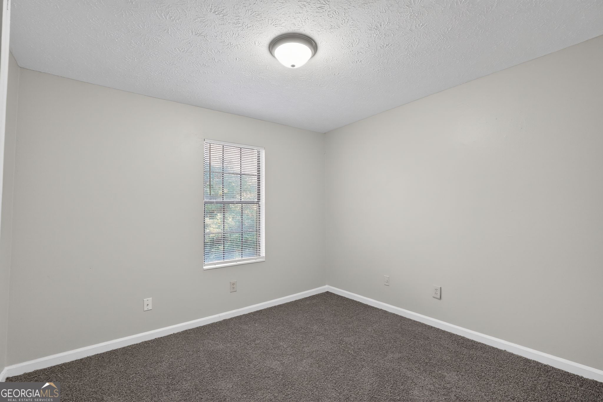 5515 Rock Springs Road Lithonia, GA 30038 - Photo 17 of 34 an empty room with a window