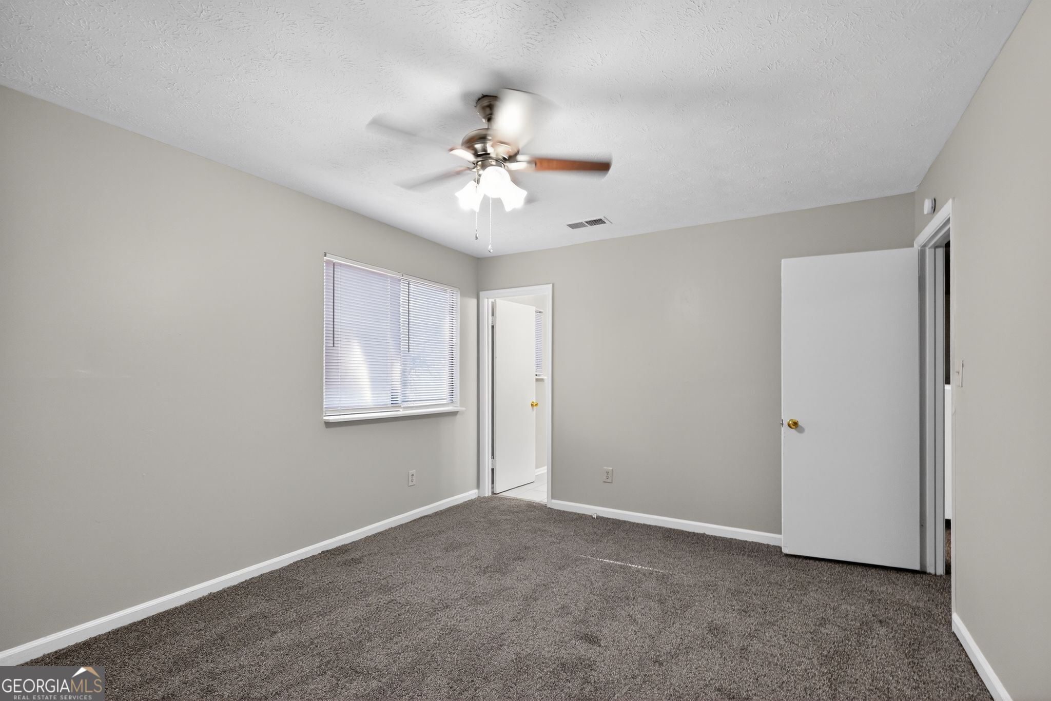 5515 Rock Springs Road Lithonia, GA 30038 - Photo 19 of 34 a view of an empty room with a window