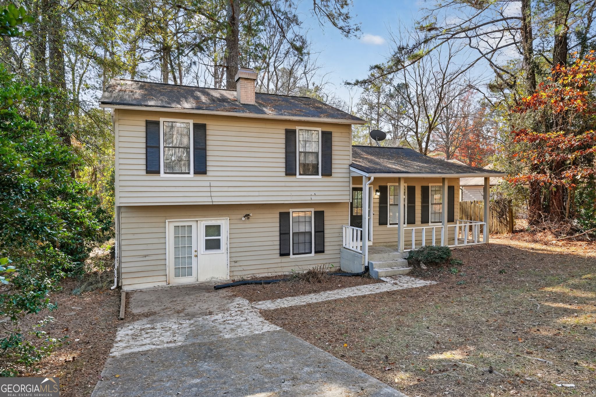 5515 Rock Springs Road Lithonia, GA 30038 - Photo 2 of 34 a front view of a house with a yard and garage