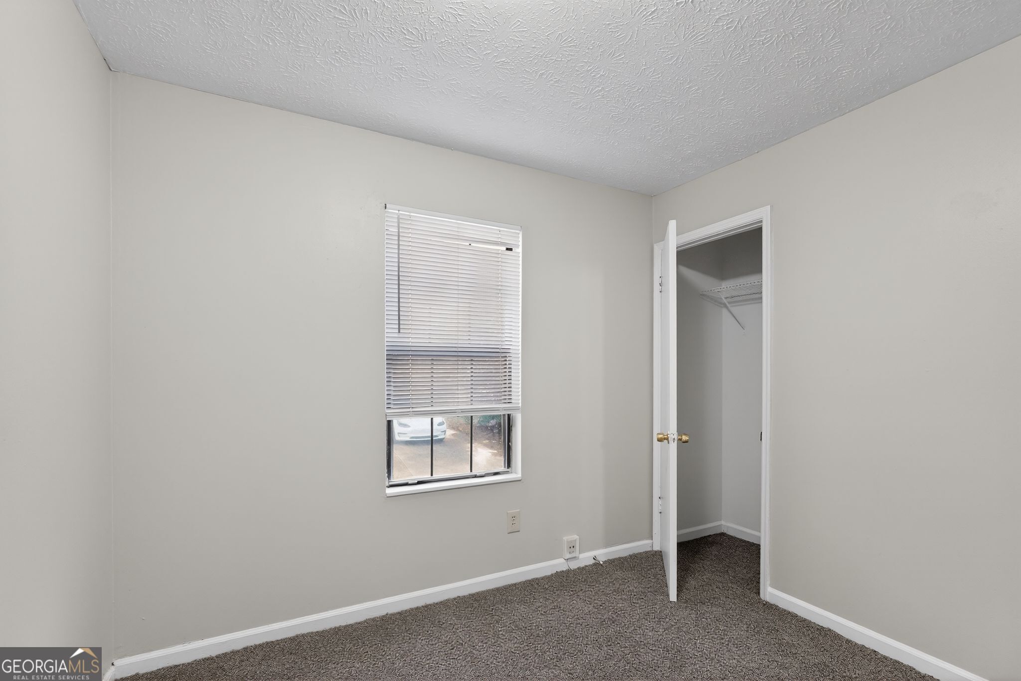 5515 Rock Springs Road Lithonia, GA 30038 - Photo 22 of 34 an empty room with windows