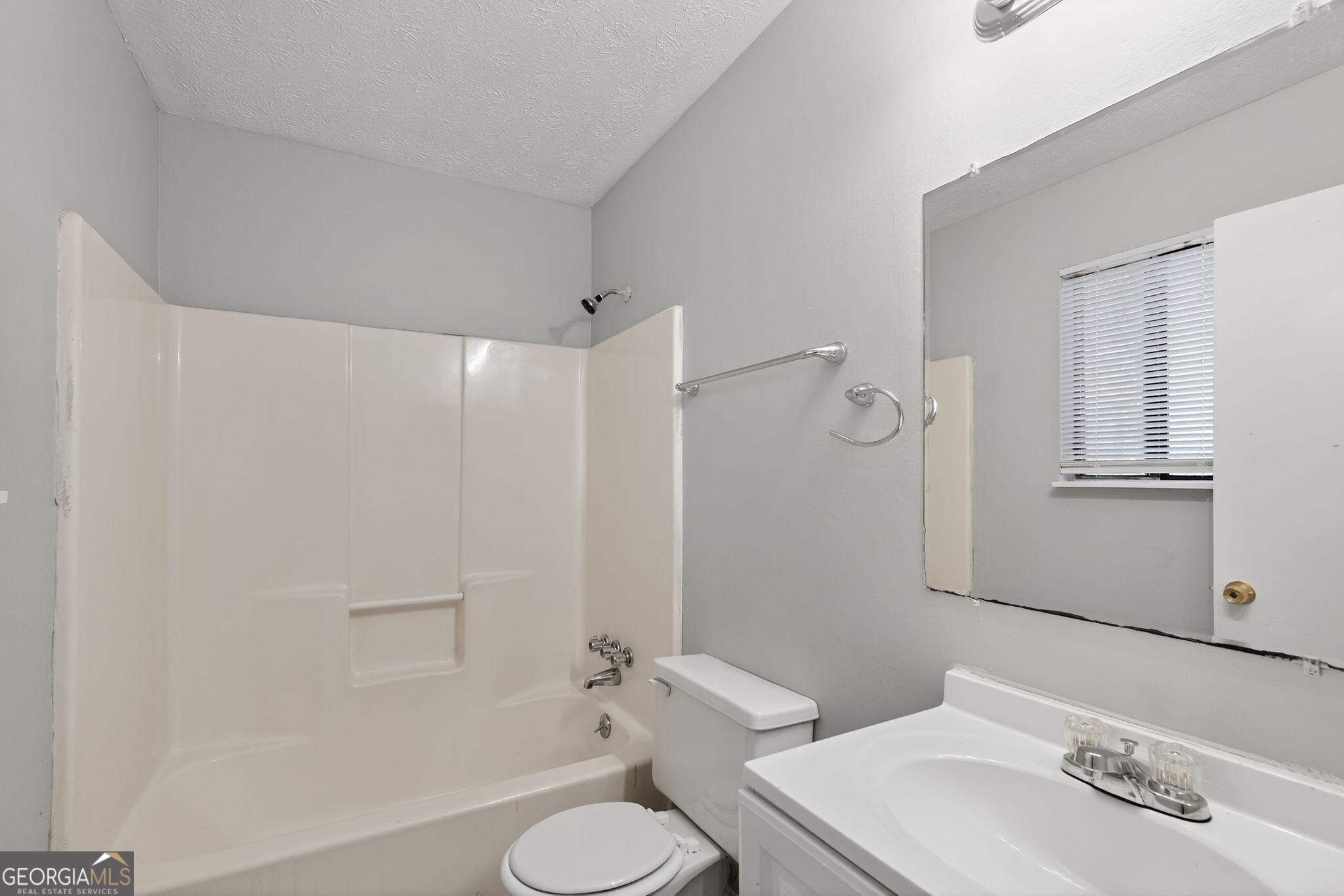 5515 Rock Springs Road Lithonia, GA 30038 - Photo 25 of 34 a bathroom with a sink toilet and shower