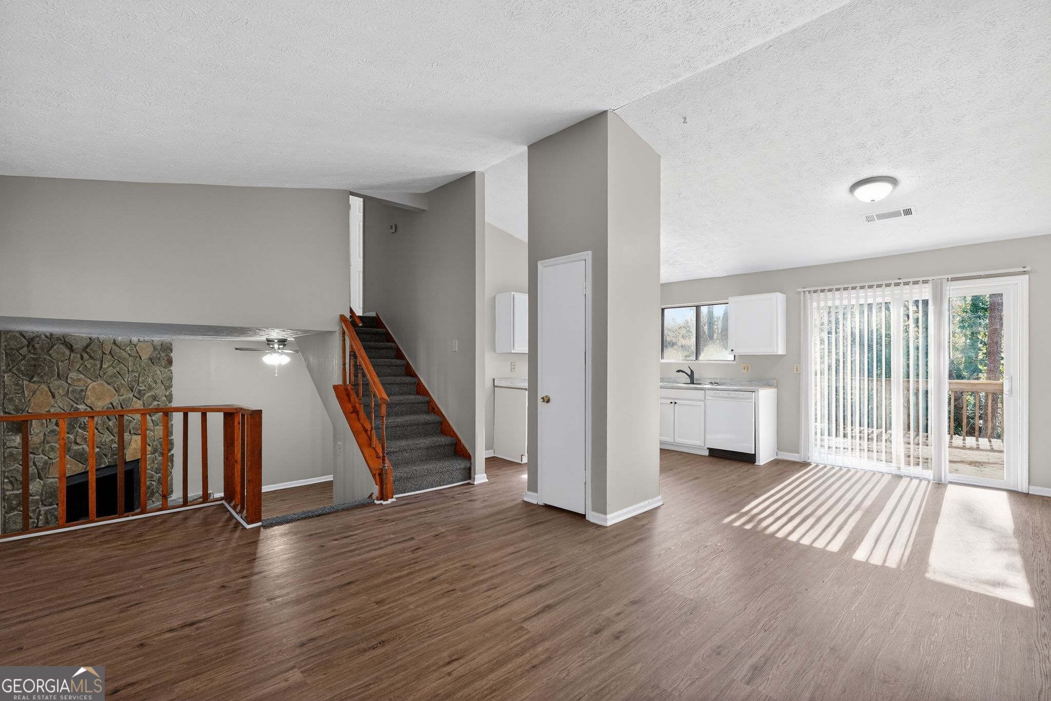 5515 Rock Springs Road Lithonia, GA 30038 - Photo 5 of 34 a view of entryway with stairs and wooden floor