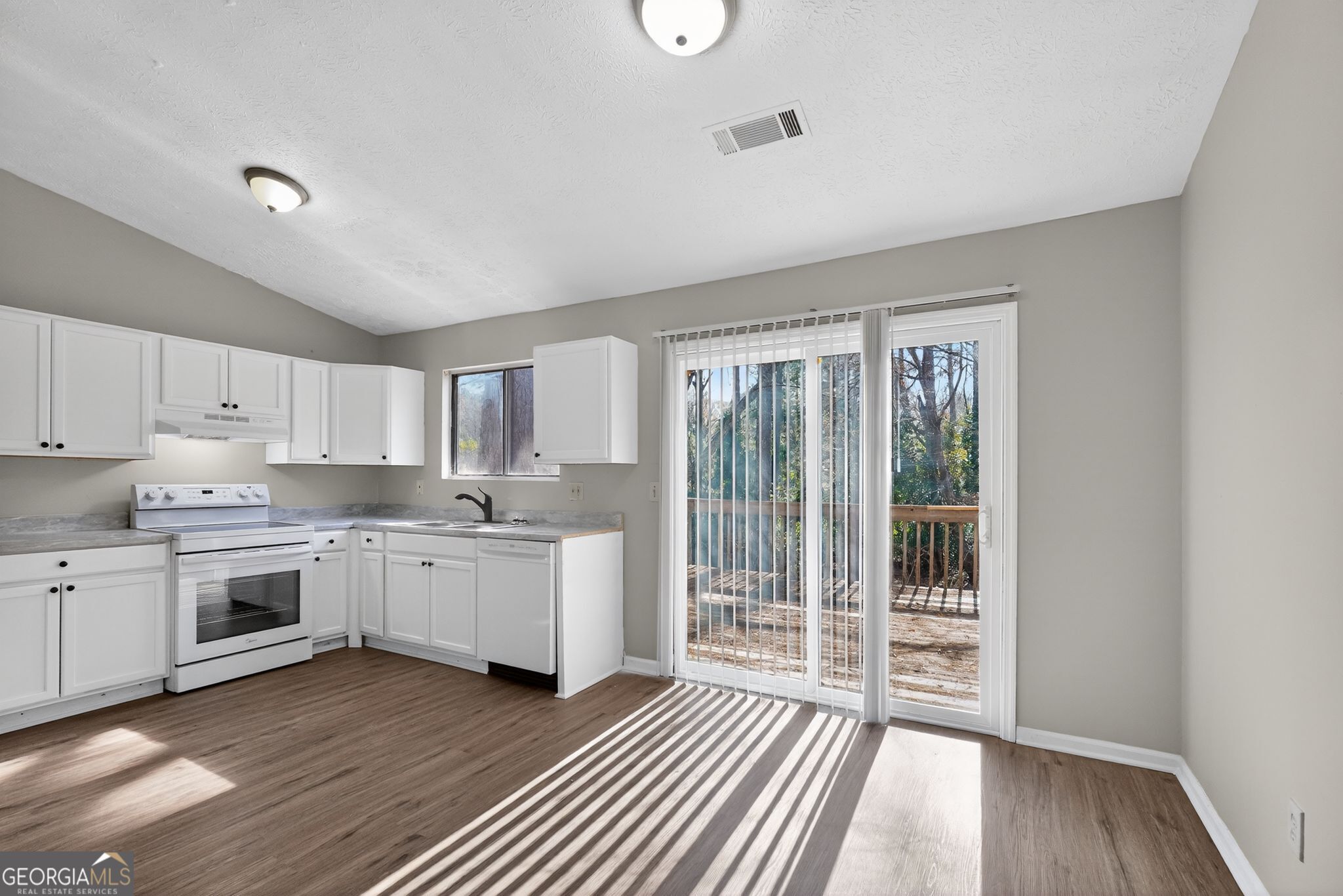 5515 Rock Springs Road Lithonia, GA 30038 - Photo 10 of 34 a kitchen with stove and sink