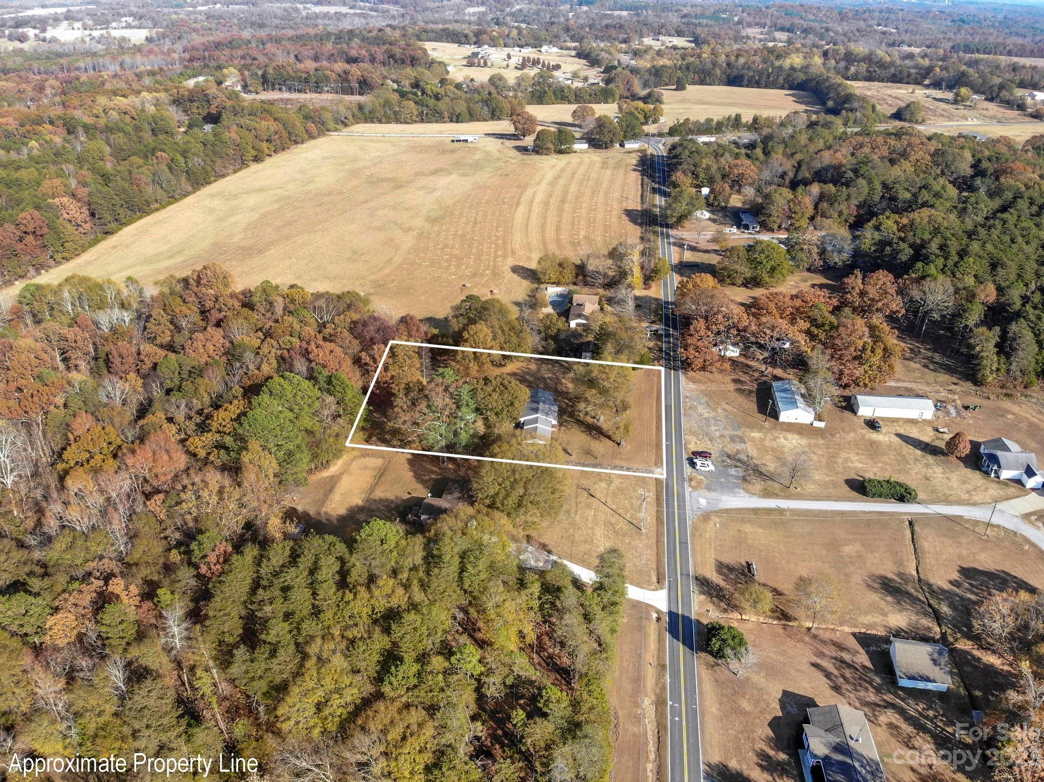 979 High Shoals Church Road Mooresboro, NC 28114 - Photo 15 of 34 an aerial view of residential houses with outdoor space