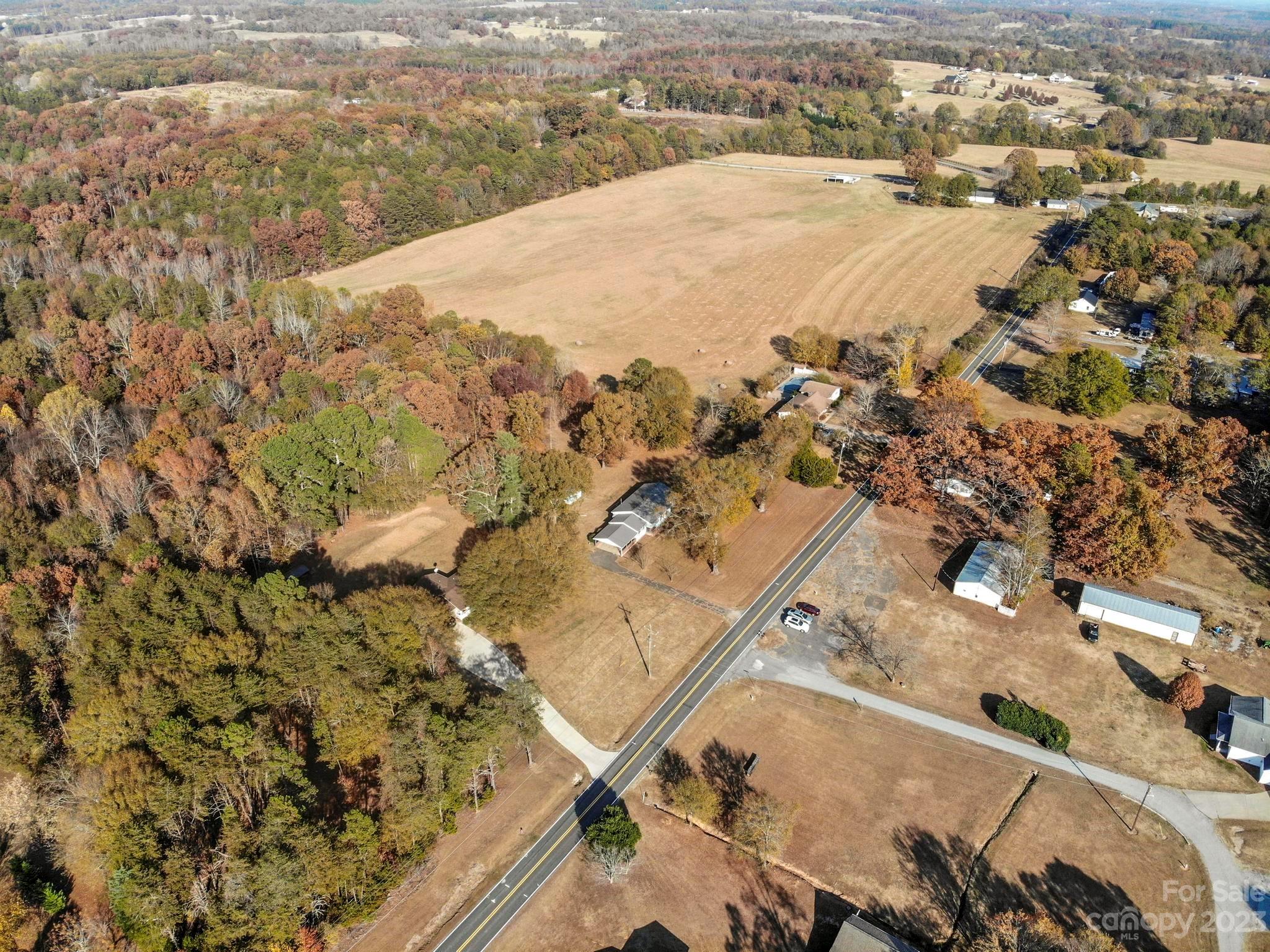 979 High Shoals Church Road Mooresboro, NC 28114 - Photo 16 of 34 an aerial view of residential houses with outdoor space