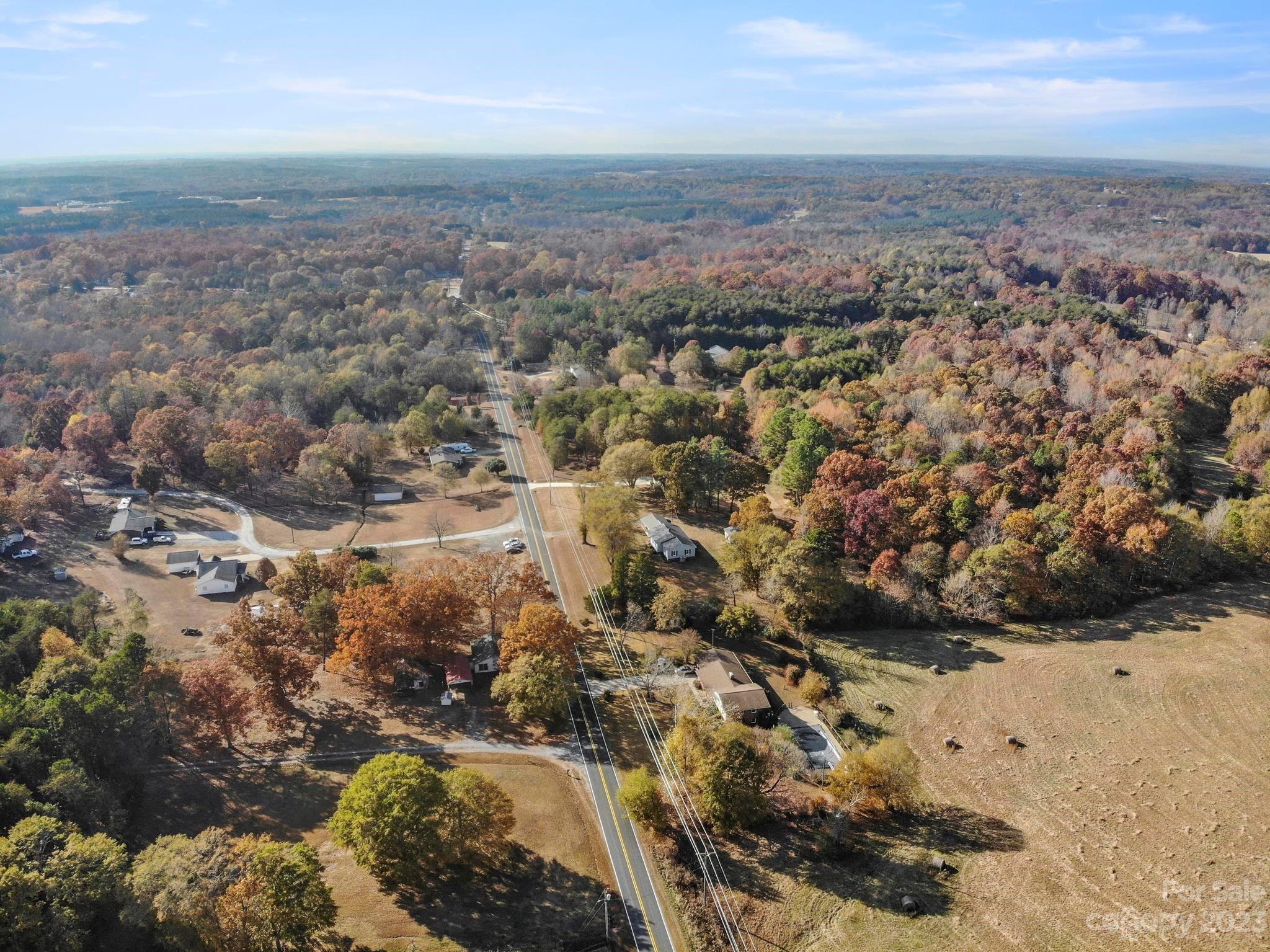 979 High Shoals Church Road Mooresboro, NC 28114 - Photo 18 of 34 an aerial view of house with yard and mountain view in back
