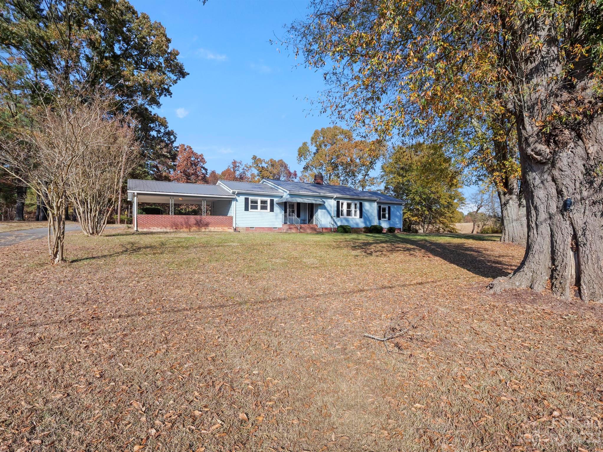 979 High Shoals Church Road Mooresboro, NC 28114 - Photo 2 of 34 a view of house with outdoor space and swimming pool