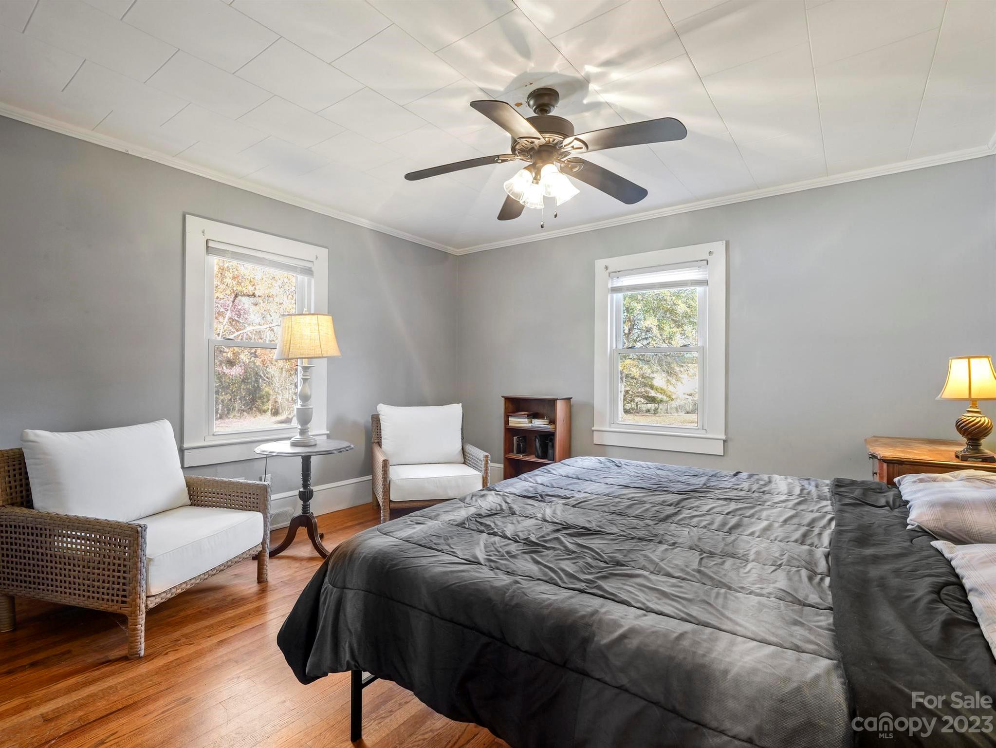 979 High Shoals Church Road Mooresboro, NC 28114 - Photo 27 of 34 a bedroom with a bed and wooden floor