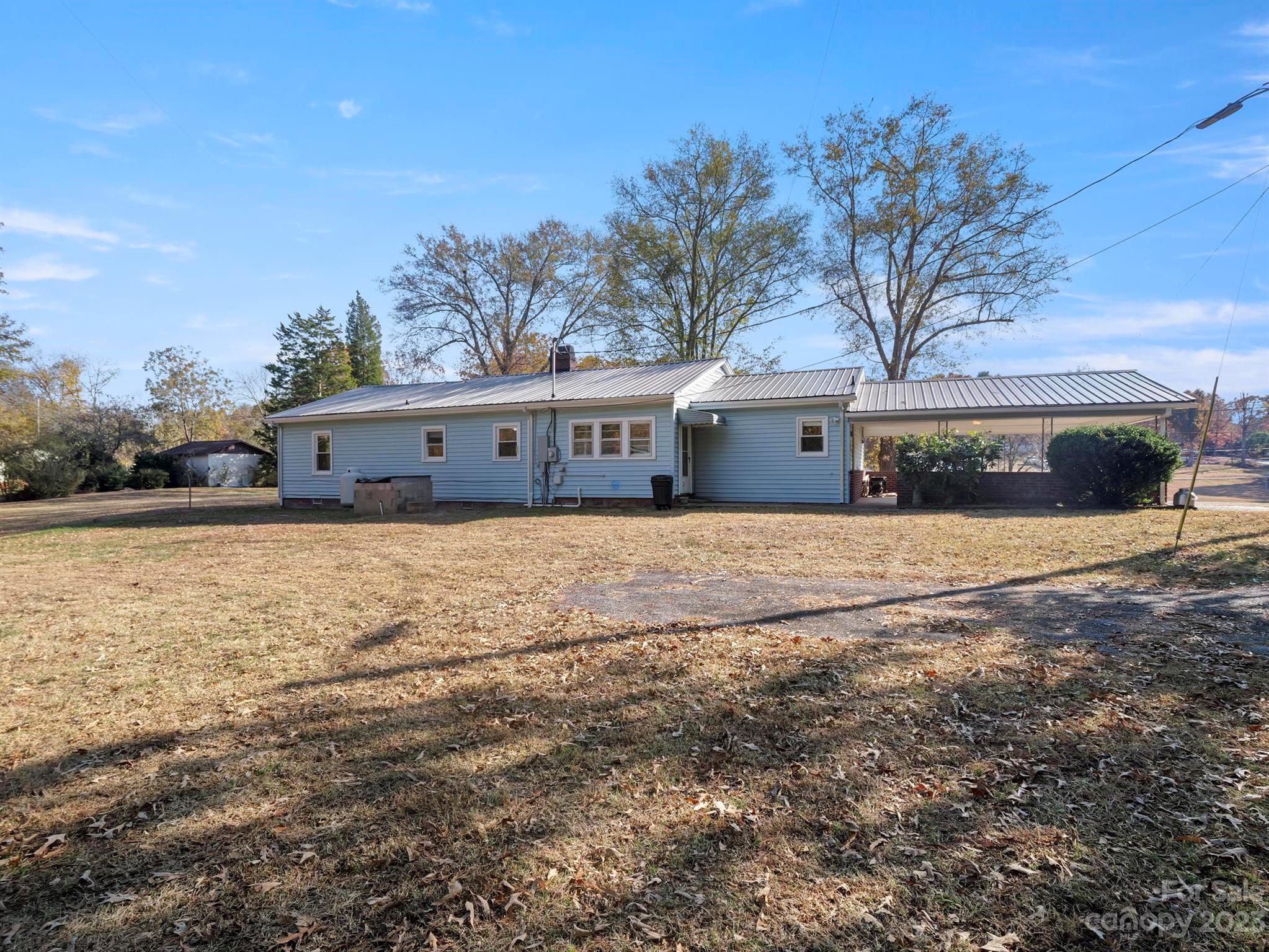 979 High Shoals Church Road Mooresboro, NC 28114 - Photo 4 of 34 a front view of a house with a yard