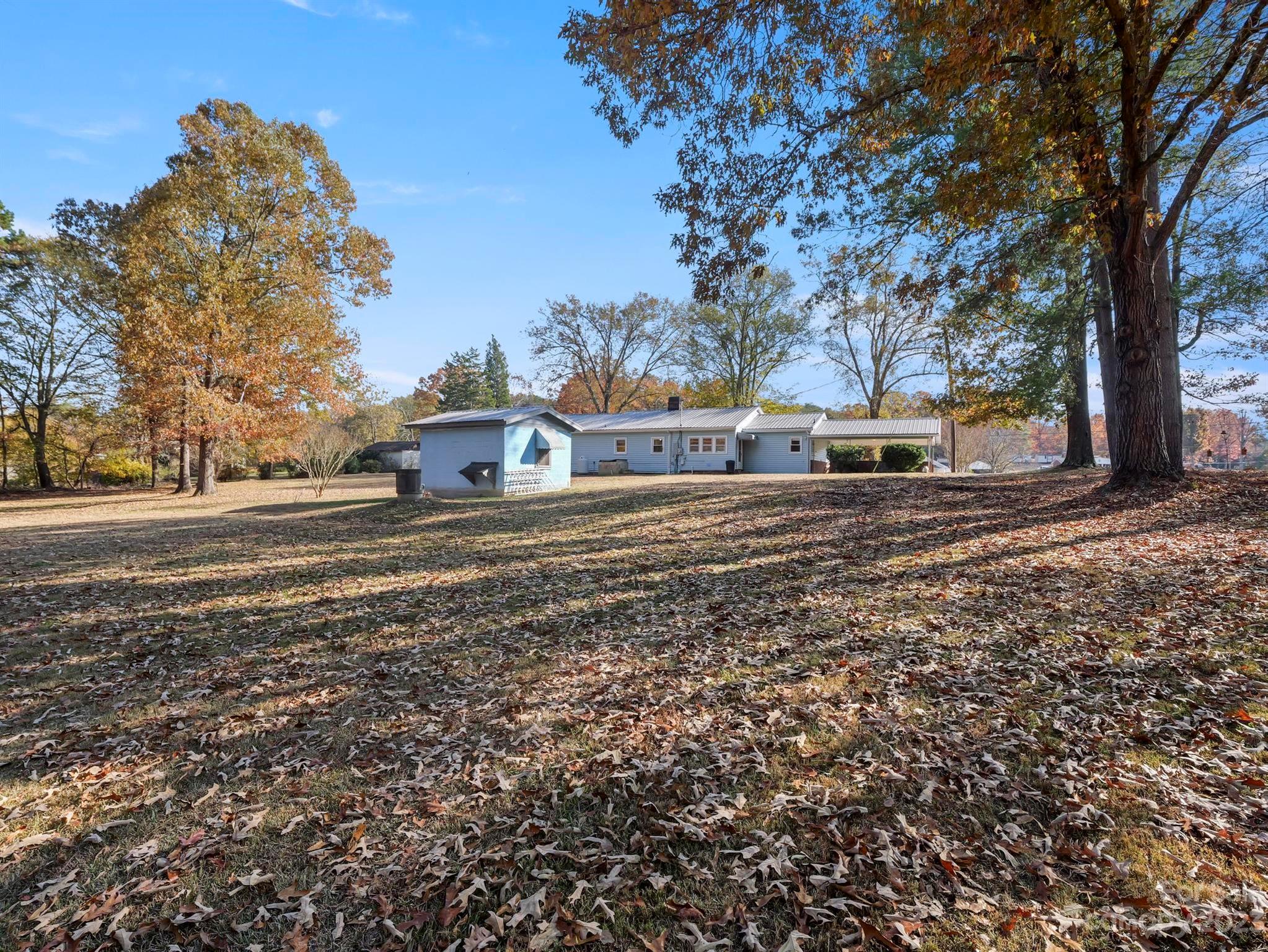979 High Shoals Church Road Mooresboro, NC 28114 - Photo 6 of 34 a view of a yard with wooden fence