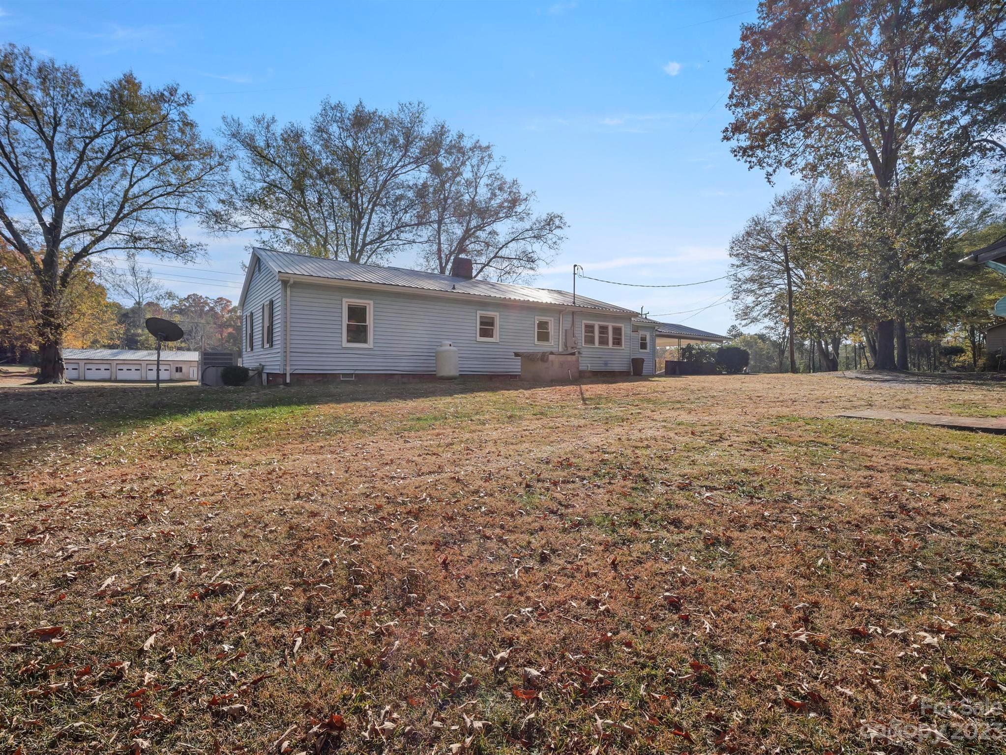 979 High Shoals Church Road Mooresboro, NC 28114 - Photo 7 of 34 a view of a yard with a house