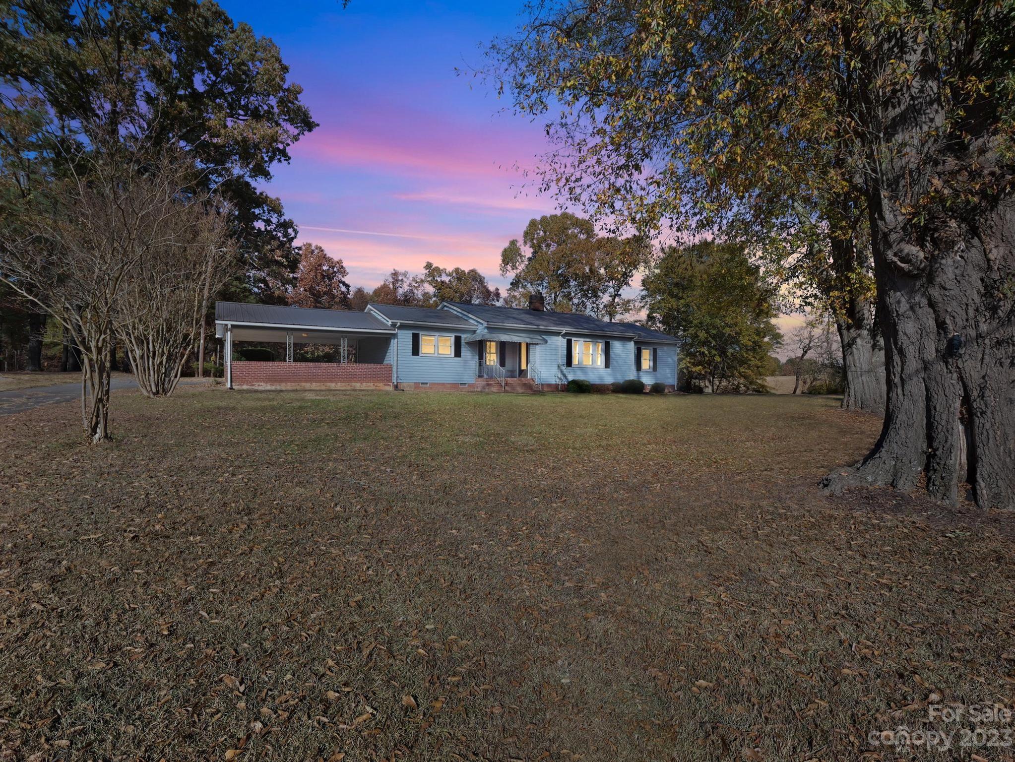 979 High Shoals Church Road Mooresboro, NC 28114 - Photo 10 of 34 a view of a house with a yard