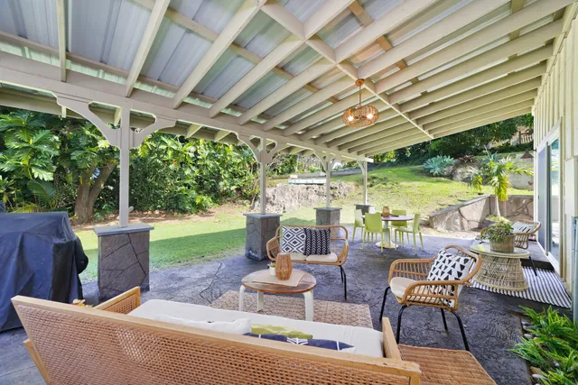 a view of a patio with chairs and a table