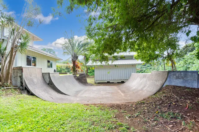 a view of a house with a yard porch and sitting area
