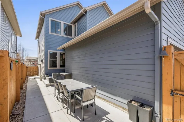 a terrace with outdoor seating and wooden floor