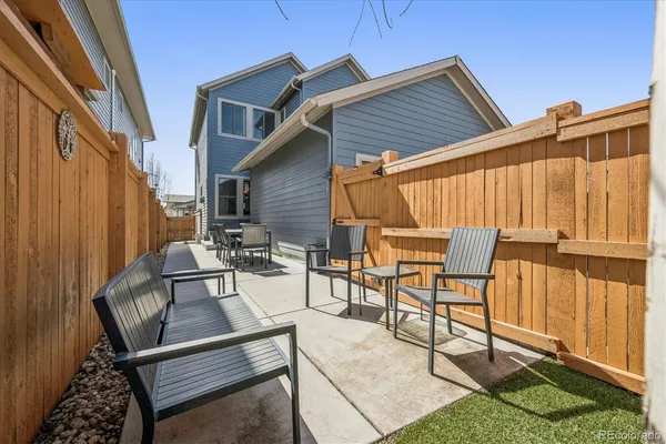 a view of a chairs and table in the patio