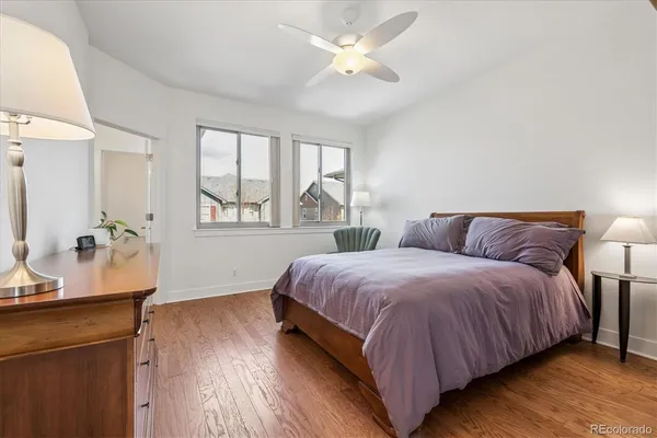 a bedroom with a bed lamps and window