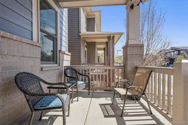 a view of two chairs in the balcony