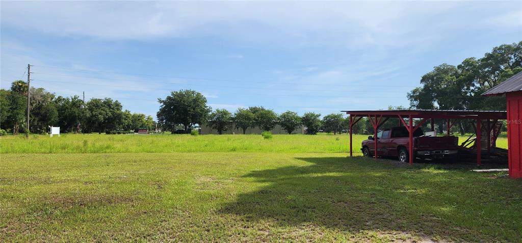 110 East 2nd Avenue Pierson, FL 32180 - Photo 6 of 11 a view of outdoor space with deck and yard