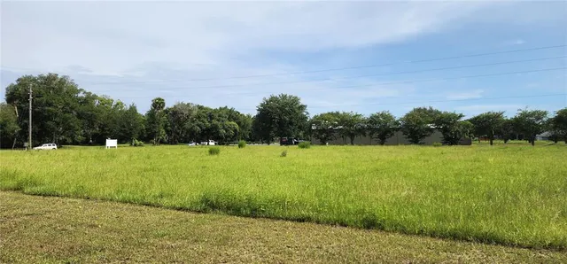 a view of park on side of road